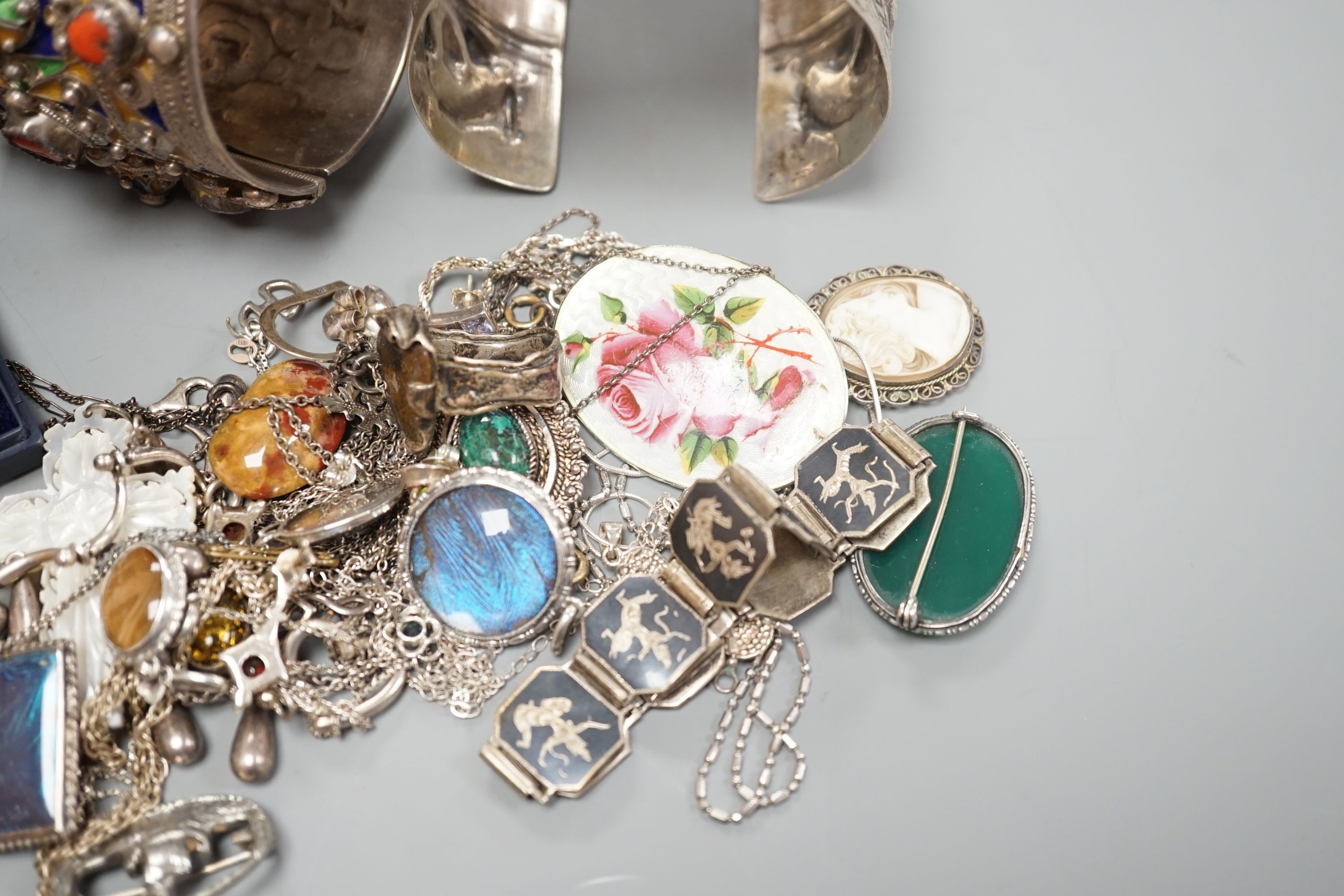 A 1950's box and a quantity of assorted costume jewellery, including continental bangles, etc.